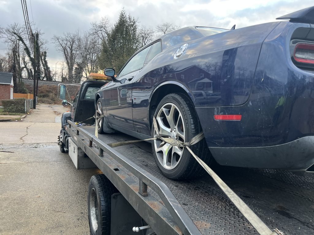 I Got Whipz Towing & Roadside Assistance with a blue dodge challenger coupe towing near me from 4200 W Rogers Ave, Baltimore, MD 21215 to 812 Martin Rd, Havre De Grace, MD 21078