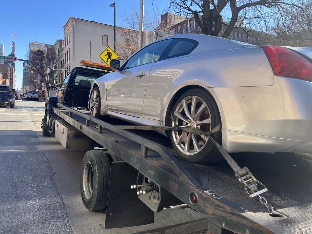 I Got Whipz Towing & Roadside Assistance with a grey infiniti g35 coupe towing near me from 501 W Baltimore st Baltimore, MD 21201 to 3700 Sequoia Ave Baltimore, MD 21215
