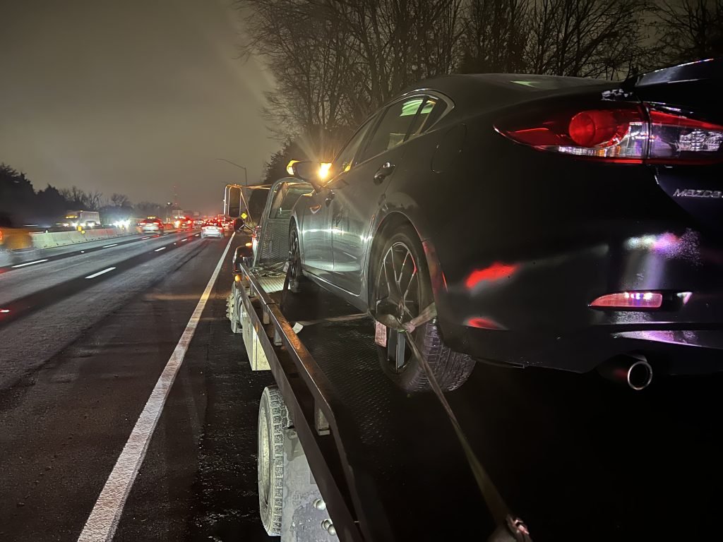I Got Whipz Towing & Roadside Assistance with a white black mazda sedan towing near me from 39.304044, -76.743808 to 8419 Liberty Rd, Windsor Mill, MD 21244