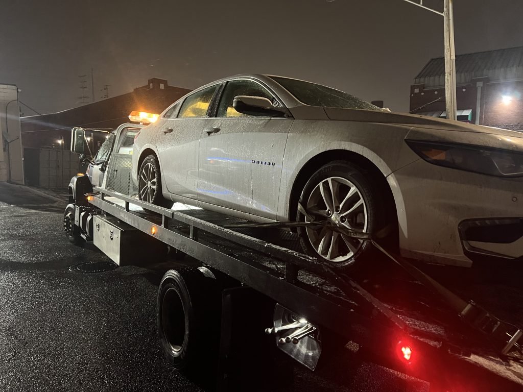 I Got Whipz Towing & Roadside Assistance with a grey Chevy Impala sedan towing near me from 1510 Reisterstown Rd, Pikesville, MD 21208 to 7200 oak haven circle Windsor Mills, MD 21244
