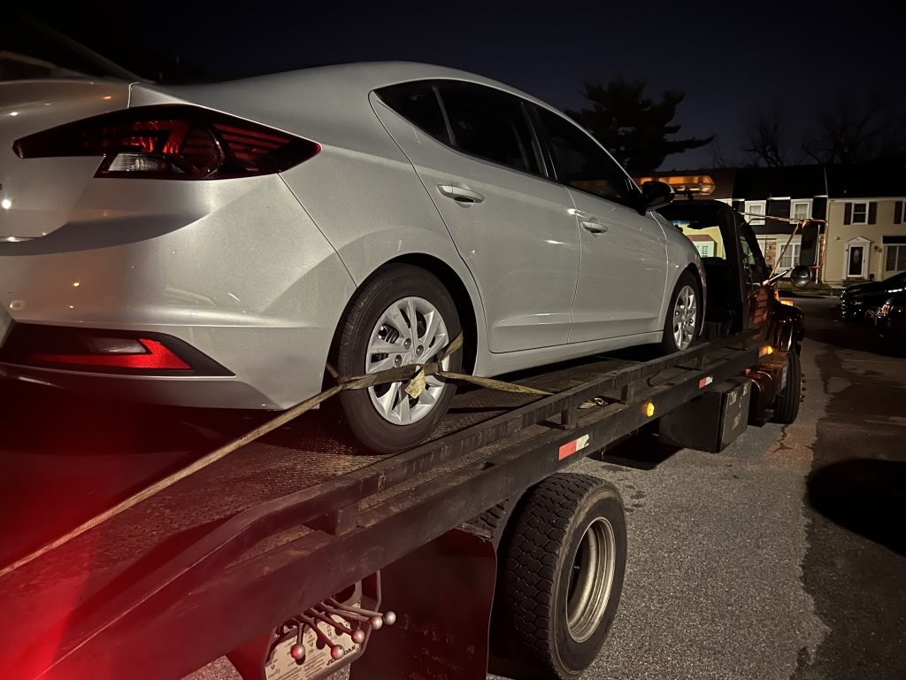 I Got Whipz Towing & Roadside Assistance with a grey hyundai sonata sedan towing near me from 78 Mountain Green Circle, Windsor Mill, MD 21244 to 6103 Reiserstown rd Baltimore, MD 21215