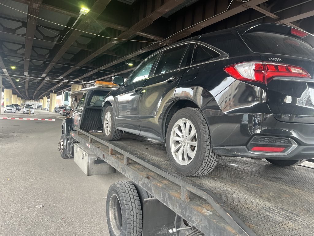 I Got Whipz Towing & Roadside Assistance with a black acura mdx suv towing near me from 410 Fallsway, Baltimore, MD 21202 to 329 N Gay St Baltimore, MD 21202