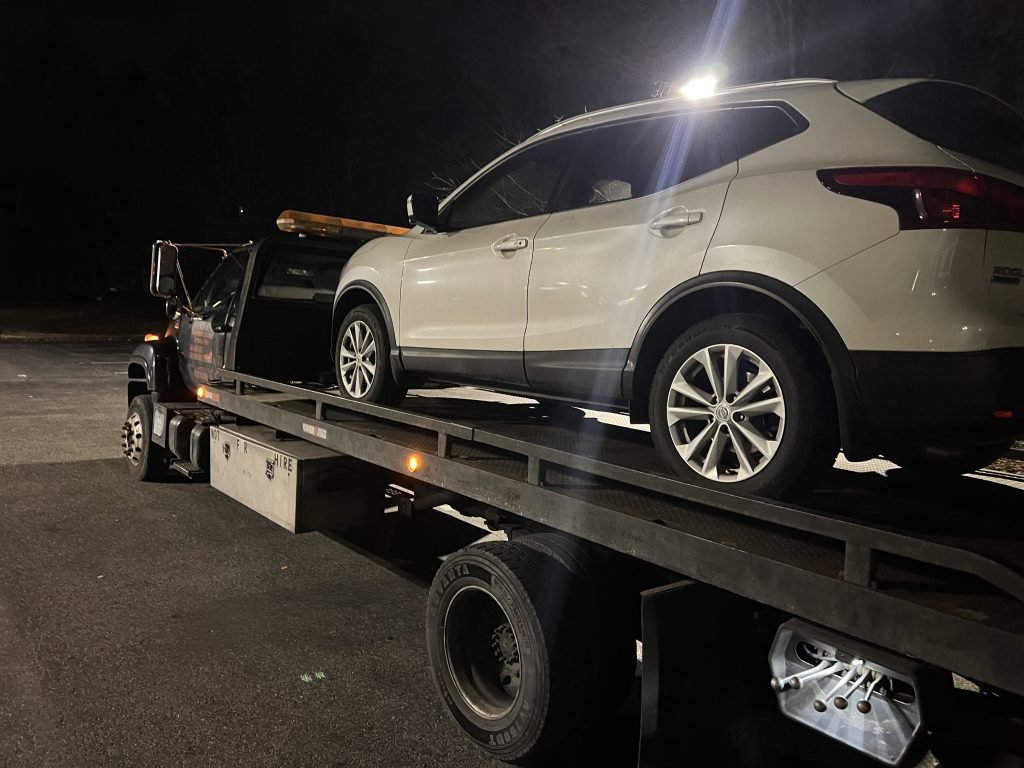 I Got Whipz Towing & Roadside Assistance with a white nisaan rogue suv towing near me from 2375 N Rolling Rd, Baltimore, MD 21244 to 43 Heatherton Ct, Windsor Mill, MD 21244