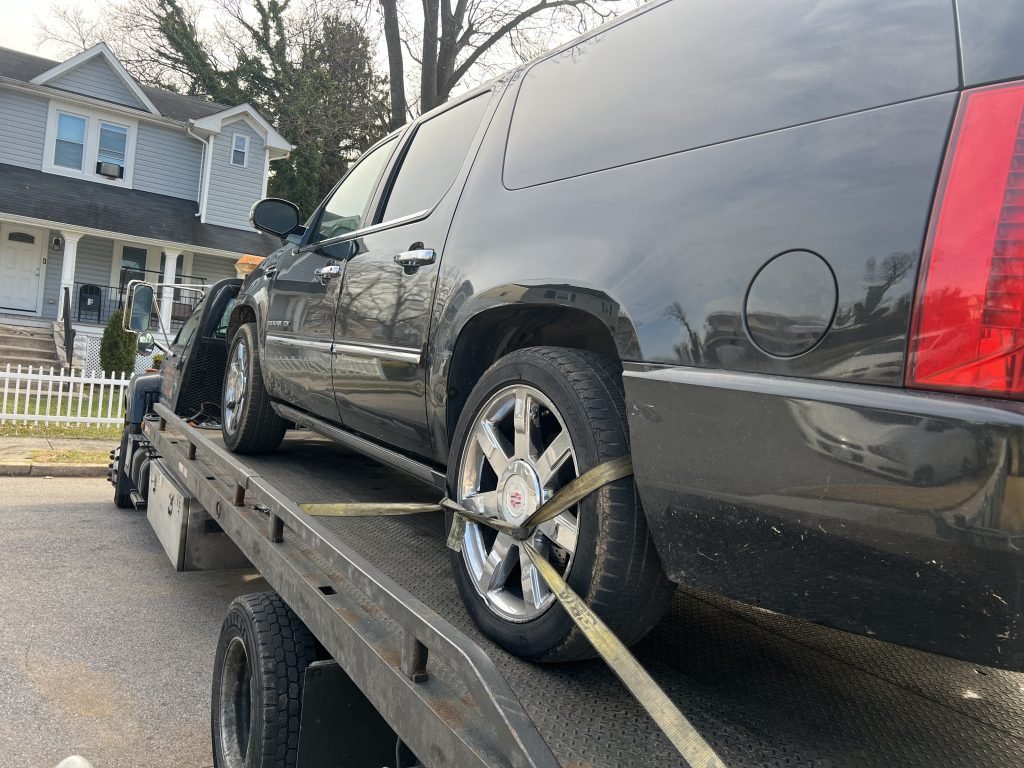 I Got Whipz Towing & Roadside Assistance with a black cadillac escalade truck towing near me from 3906 ferndale ave Baltimore, MD 21207 to 4800 Eleanora Ave Baltimore, MD 21215