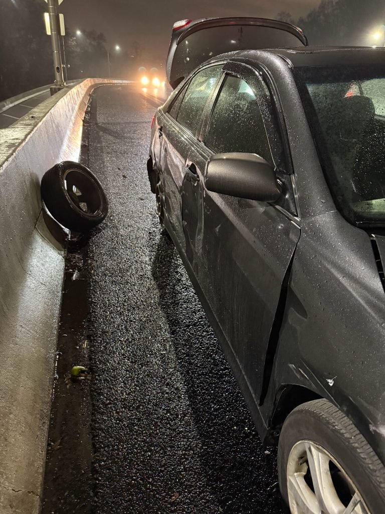 I Got Whipz Towing & Roadside Assistance with a grey toyota camry sedan doing roadside assistance doing a tire change for a customer at 39.324715, -76.633907