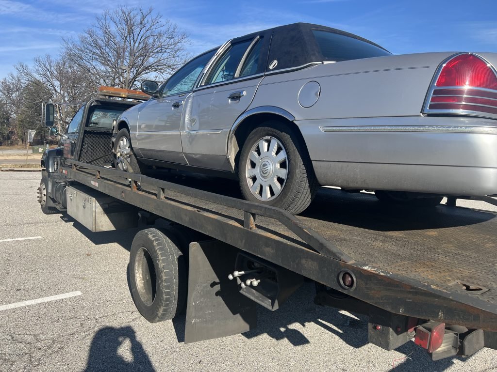 I Got Whipz Towing & Roadside Assistance with a grey mercury grand marquis sedan towing near me from 2000 S Caton Ave, Halethorpe, MD 21227 to 3873 Cedardale Rd Baltimore, MD 21215