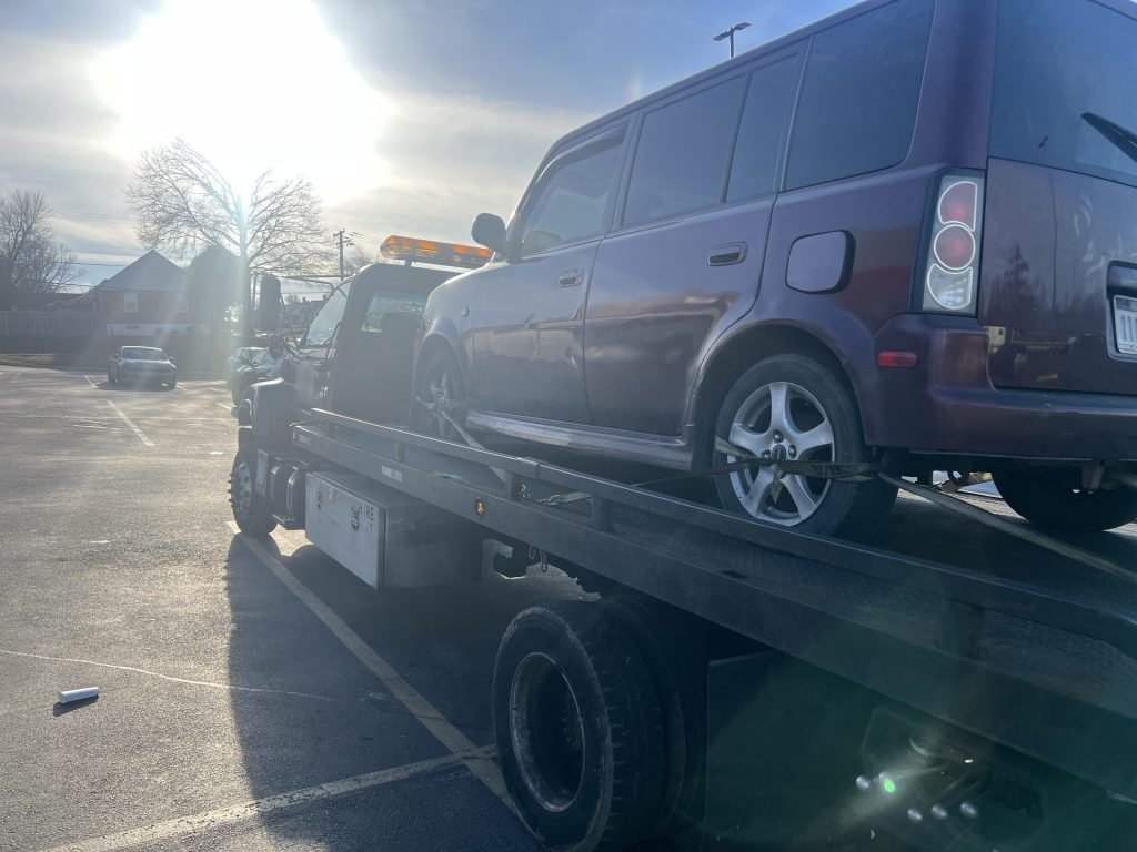 I Got Whipz Towing & Roadside Assistance with a purple scion cube suv towing near me from 7003 Liberty Rd, Gwynn Oak, MD 21207 to 495 Premium Outlets Blvd, Hagerstown, MD 21740