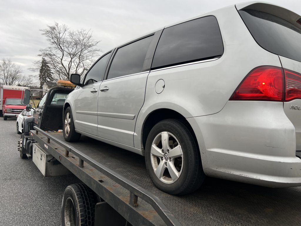 I Got Whipz Towing & Roadside Assistance with a grey volkswagen routan van towing near me from 39.312605, -76.744807 to 3637 Coronado Rd Milford Mill, Maryland 21207