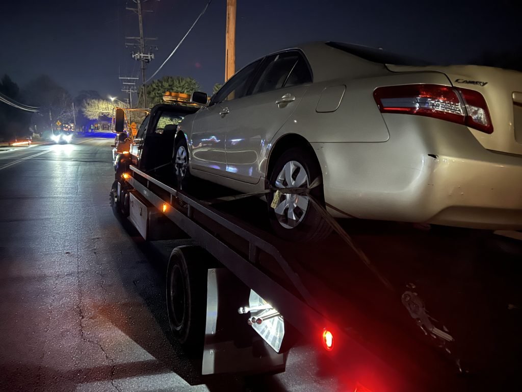 I Got Whipz Towing & Roadside Assistance with a gold Toyota Camry sedan towing near me from 15635 Millbrook Lane Laurel, MD 20707 to 4120 W Belvedere Baltimore, MD 21215