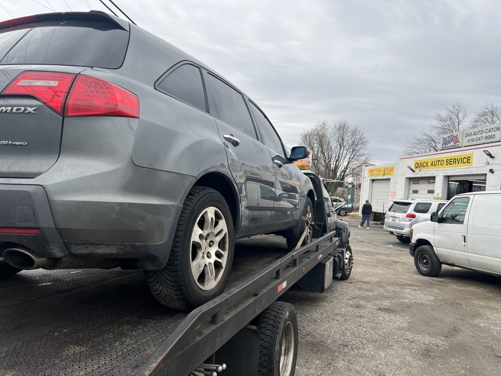 I Got Whipz Towing & Roadside Assistance with a grey Acura MDX suv towing near me from 3301 Washington Blvd, Halethorpe, MD 21227 to 2125 Holly AveBaltimore, MD 21216